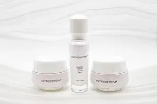 Three IntroStem skincare products on a white background: a serum and two jars.