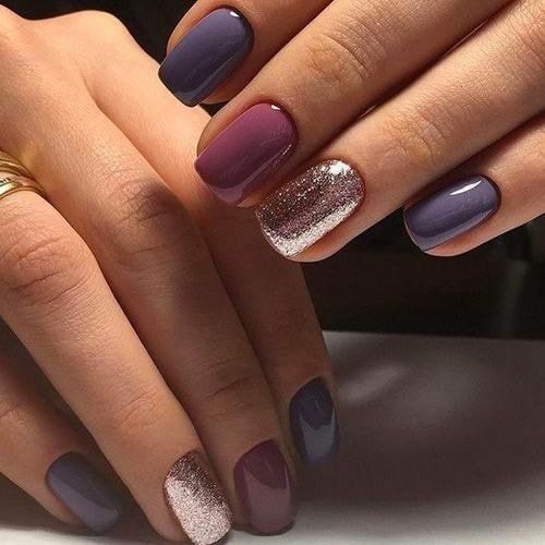 shades of purple with glitter accent nail