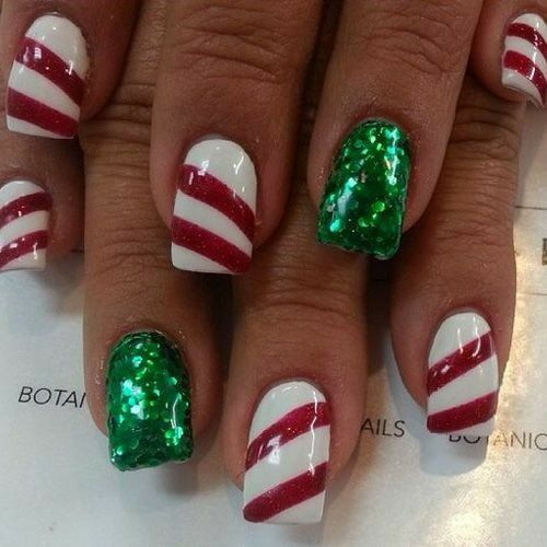 candy cane stripe nails with green glitter accent nail