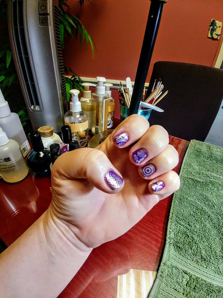 purple nails with metallic swirl designs