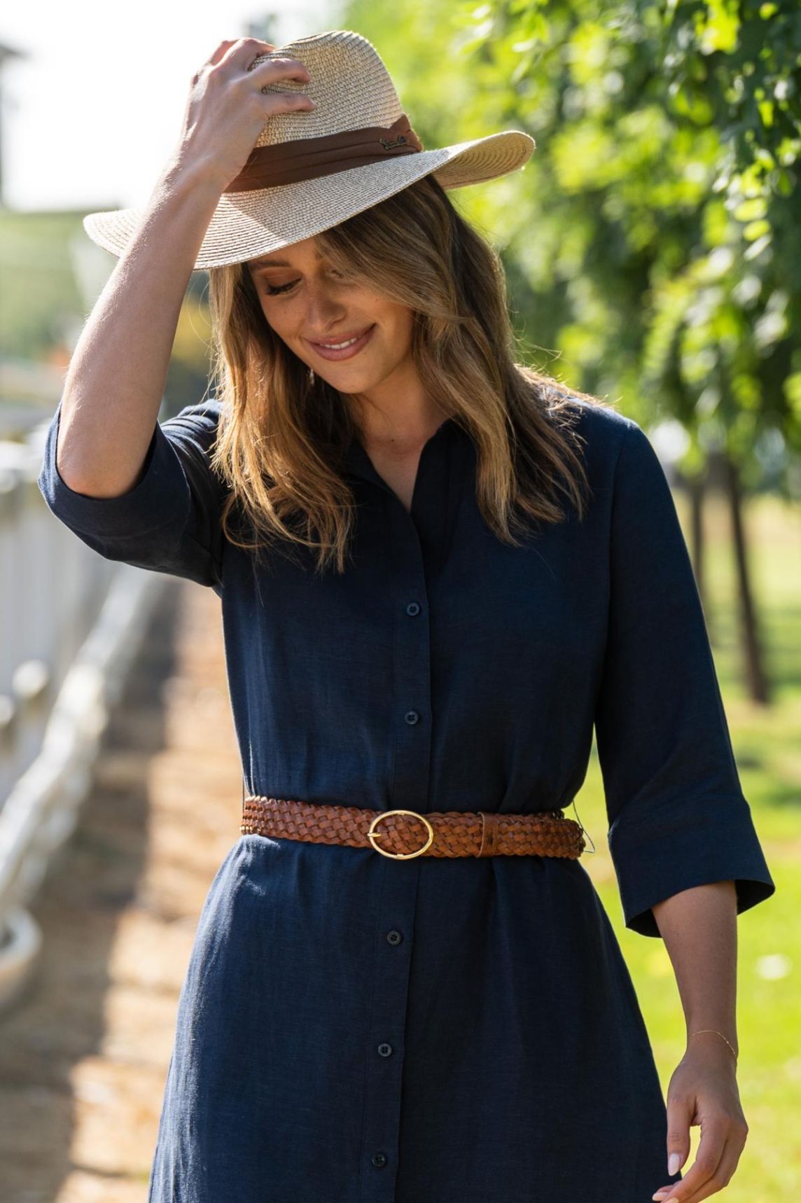 A Woman Wearing A Blue Dress And A Straw Hat — Shellie's Country Wear In Nabiac, NSW