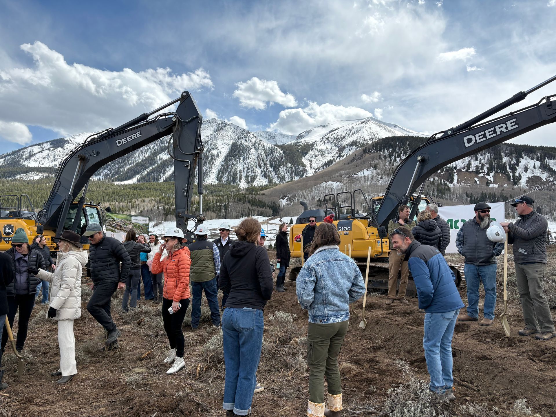 man and woman walking in front of housing 