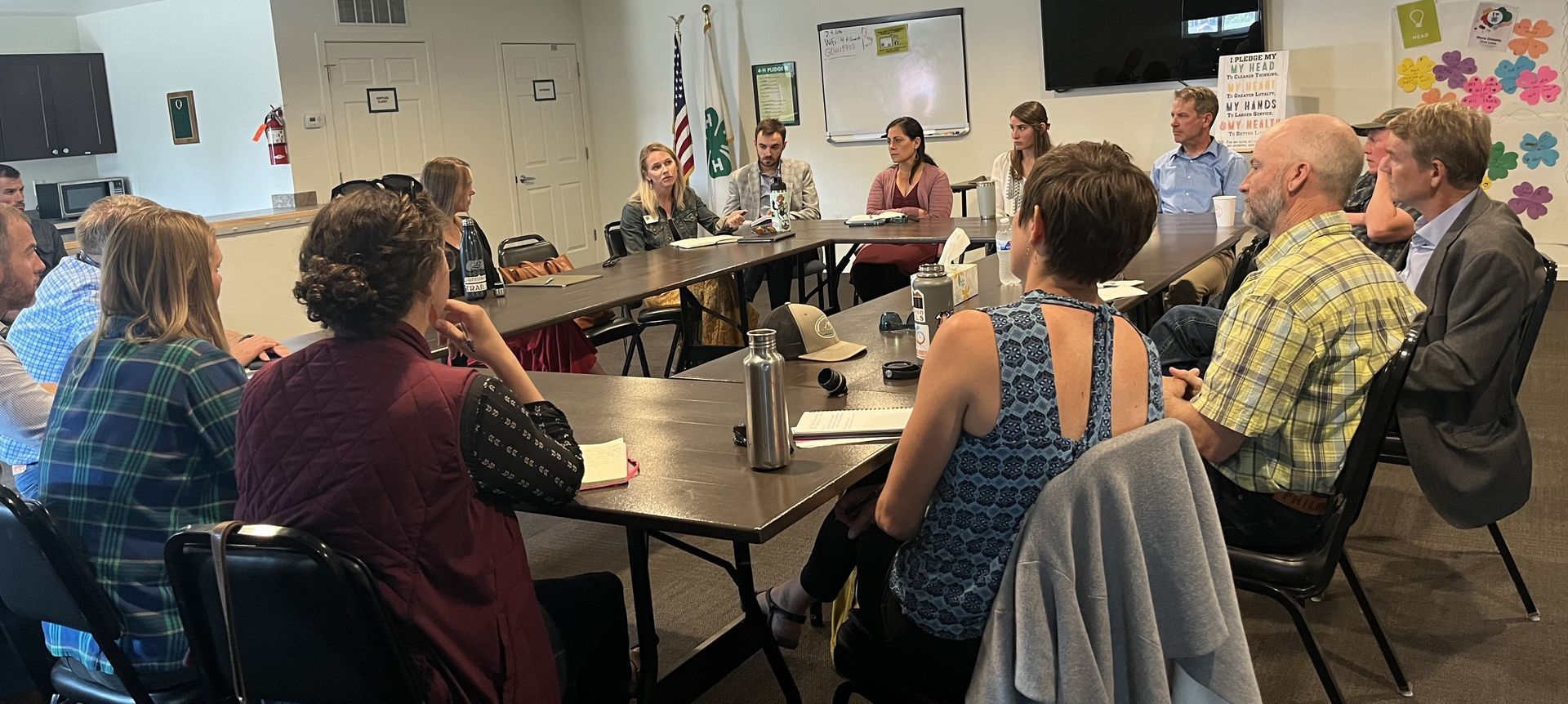 people sitting around conference table