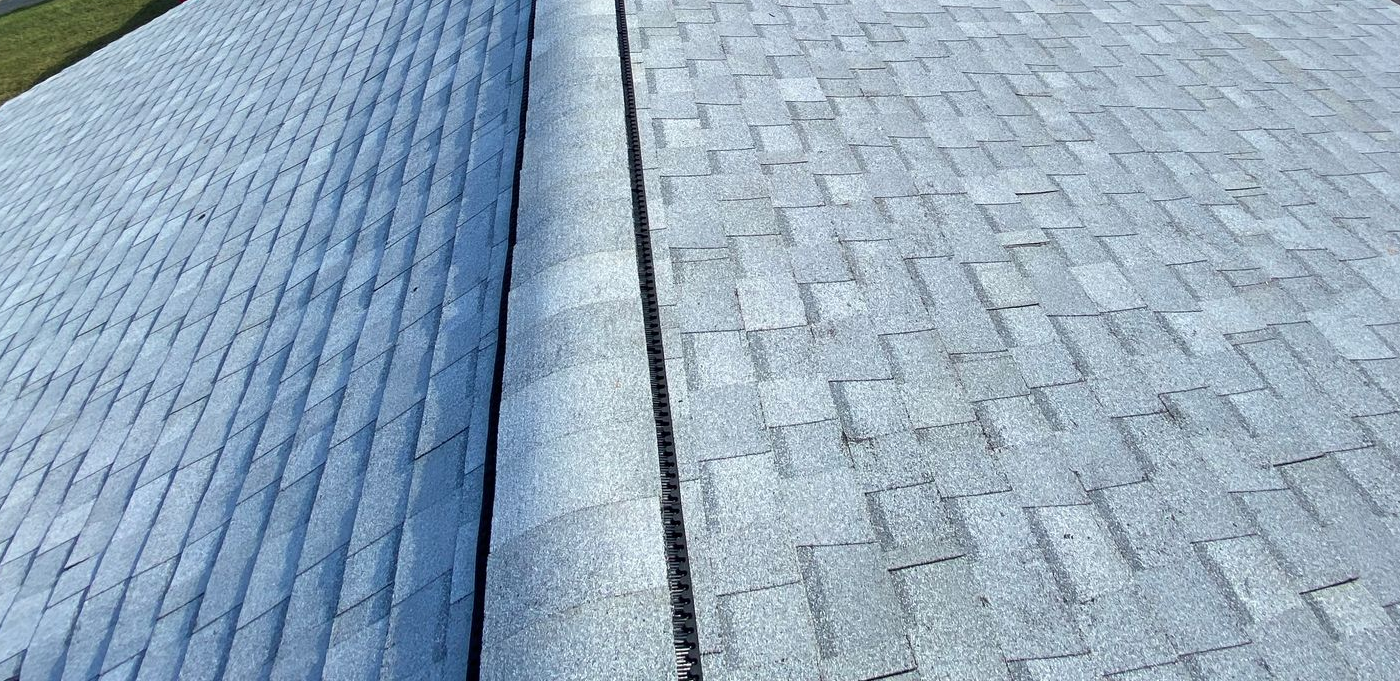 Two roof sections meeting, one smooth, one with shingles.