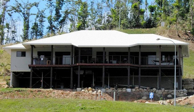Large House with White Roof — Builders in Cannonvale, QLD