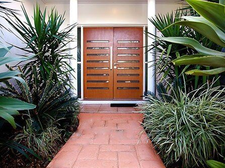 House Entrance with Large Wooden Door — Builders in Cannonvale, QLD