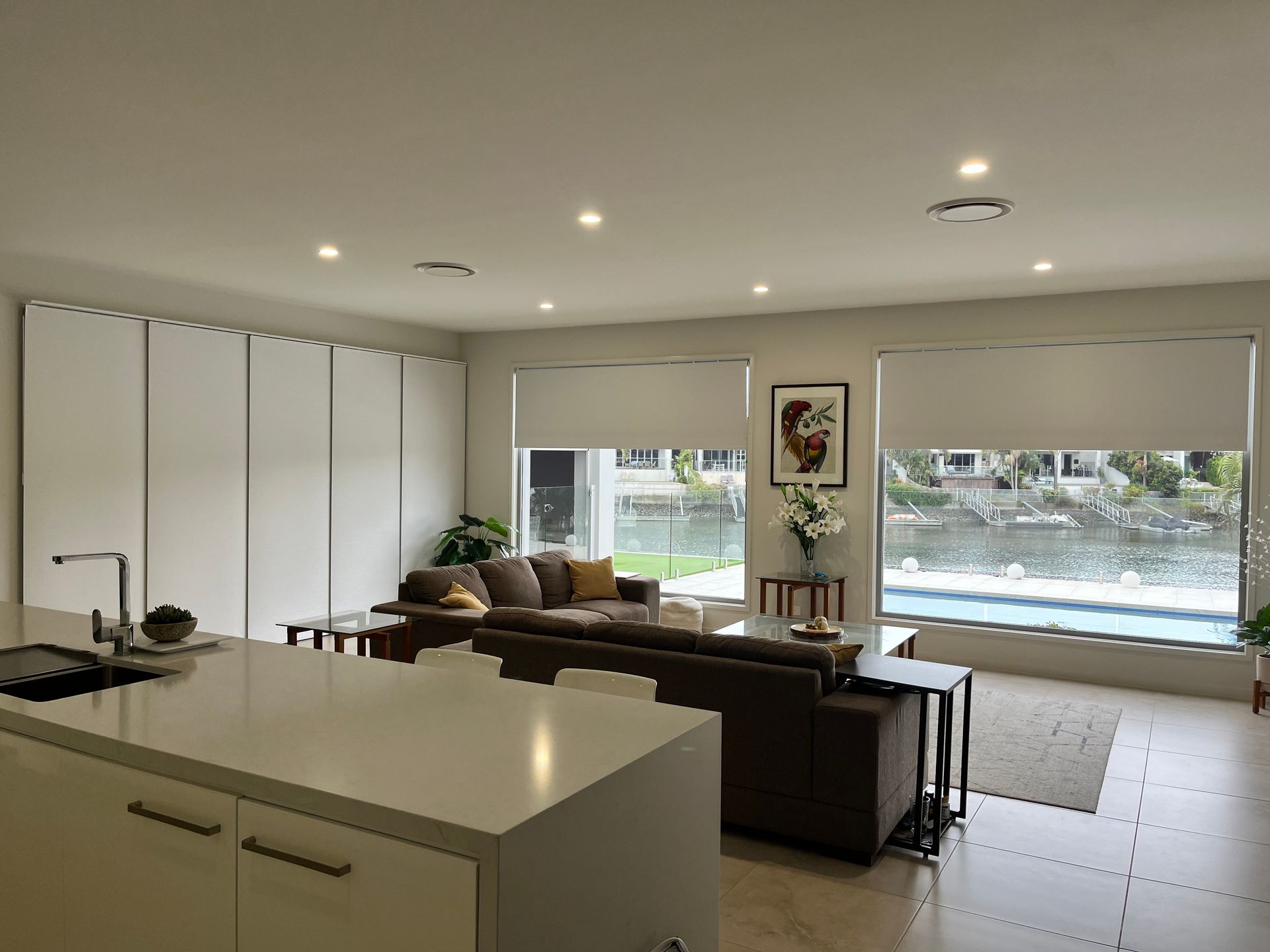 A Man Is Looking Out Of A Window With A Screen On It  — Budget Home Improvements In Tweed Heads South, NSW