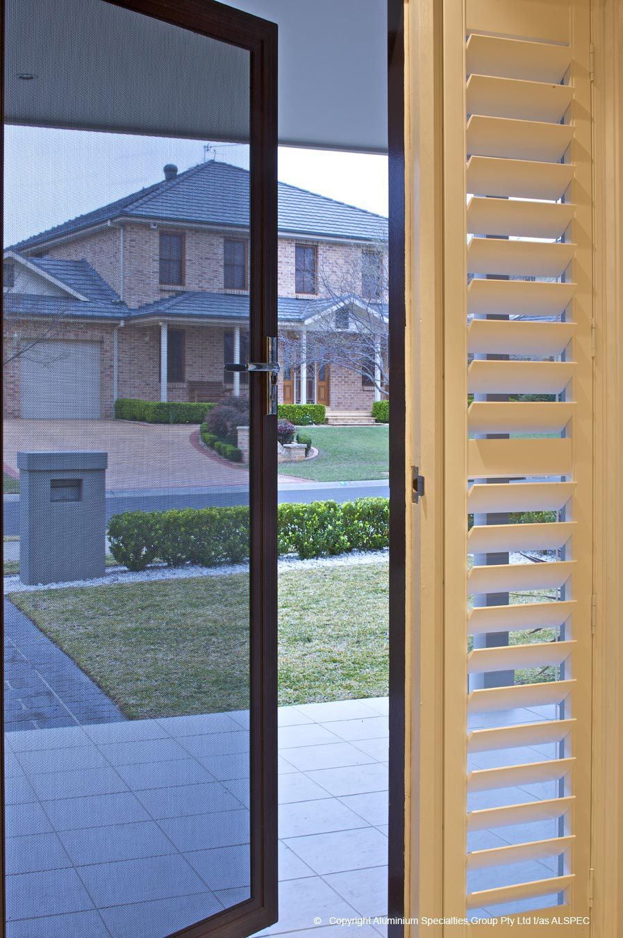 A Close Up Of A Window With A Roller Shutter On It — Budget Home Improvements In Tweed Heads South, NSW