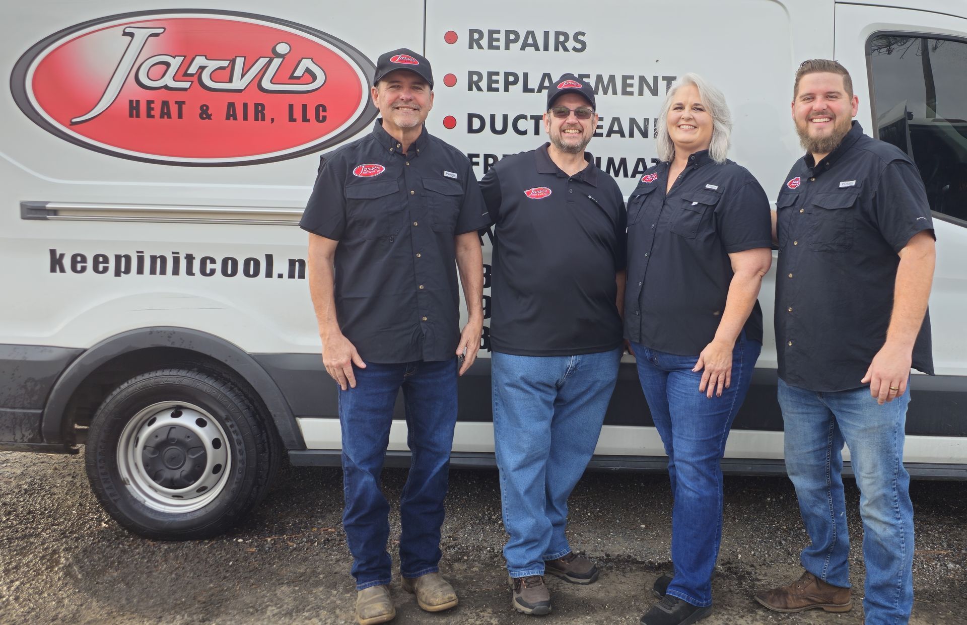 Group of people in front of a building, and a dog.