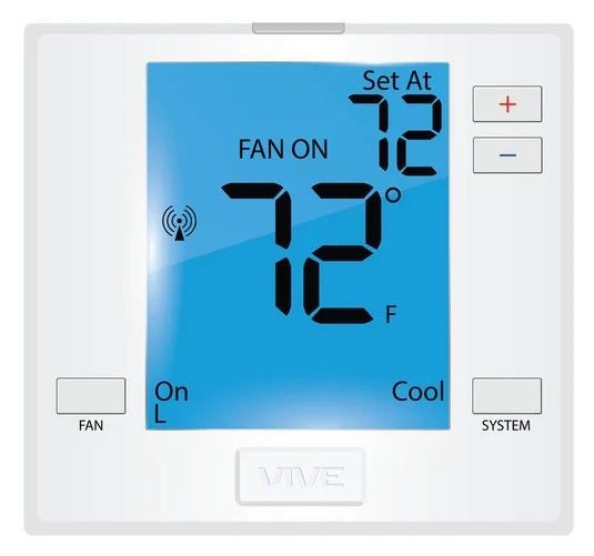 Person adjusting thermostat on phone, matching the wall-mounted thermostat display: both show 77 degrees.