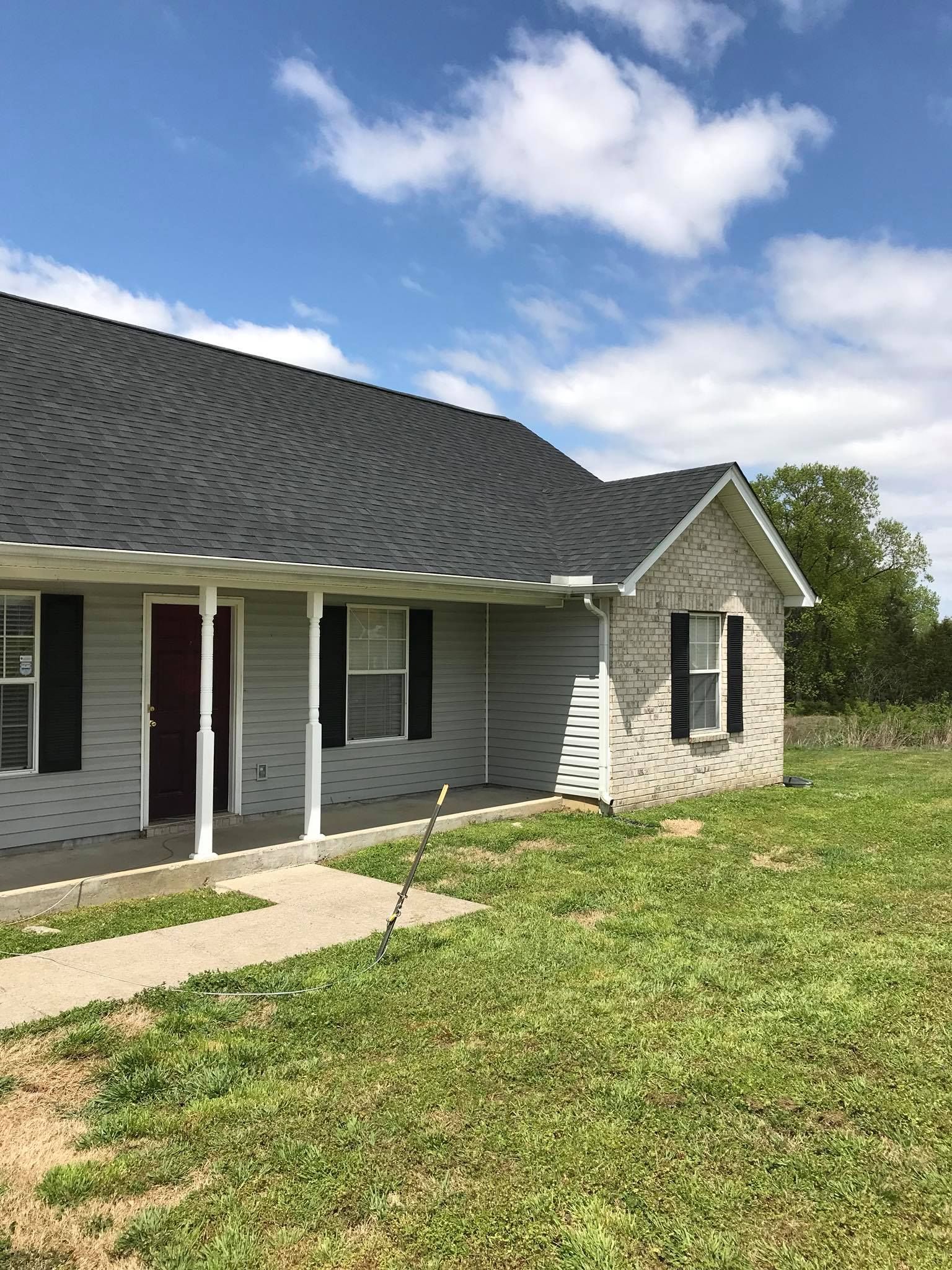 a white house with a black roof