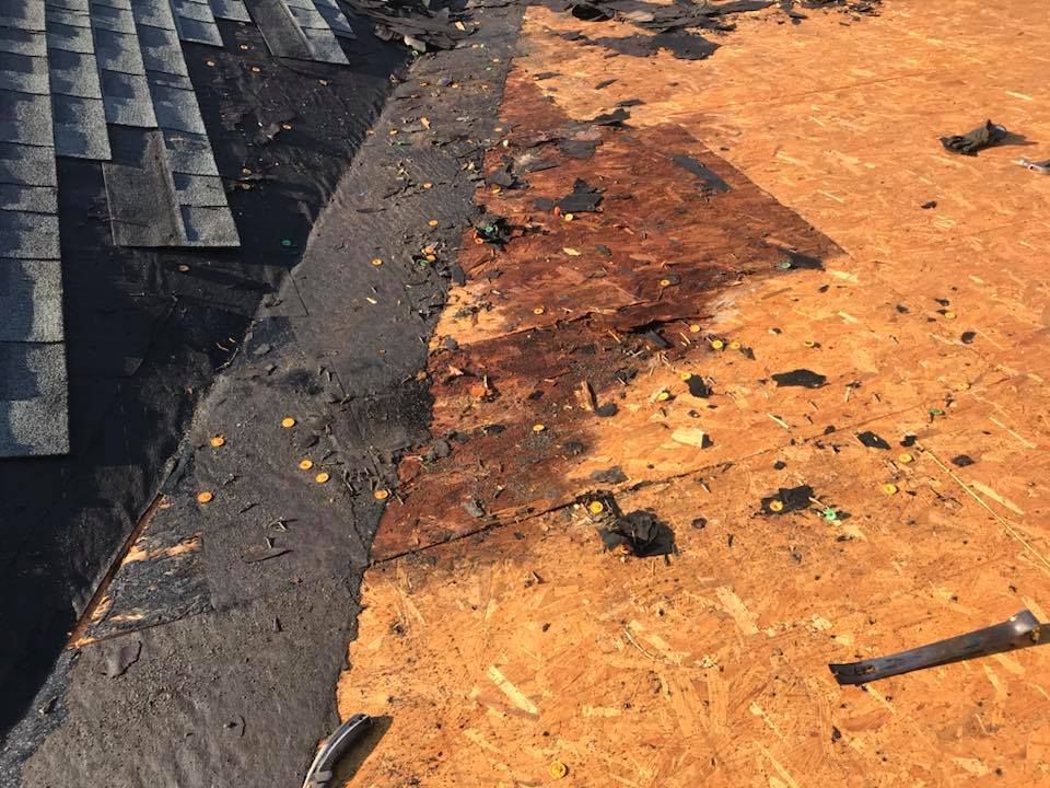 a close up of a roof with a lot of damage on it