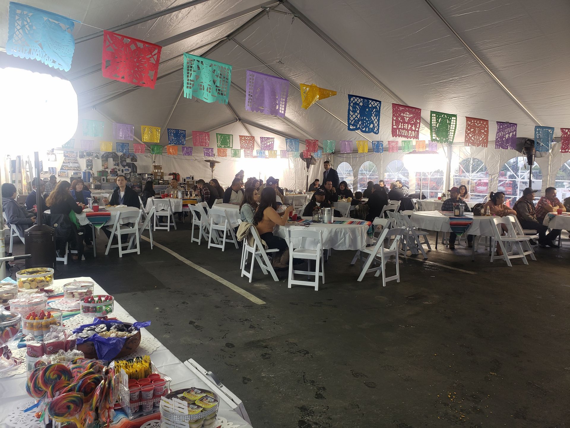 A long table with a lot of food on it in a room.