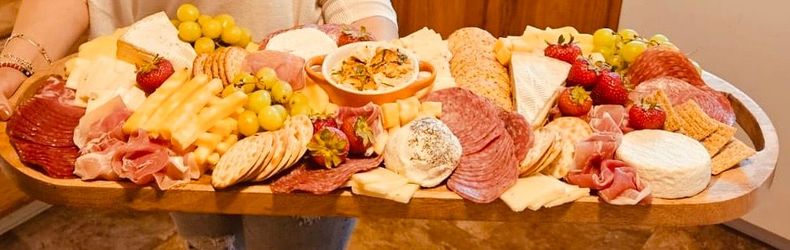 Image of a charcuterie board full of food 