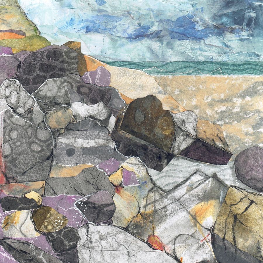 Abstract mosaic of colorful stones on a rocky shoreline beneath a cloudy blue sky