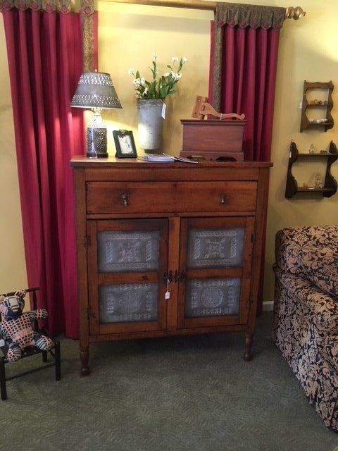 curtains installed behind the cabinets