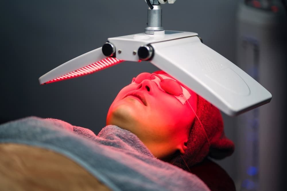 Woman Receiving Red Light Treatment — Embrace Cosmetic Clinic in Bundaberg North, QLD