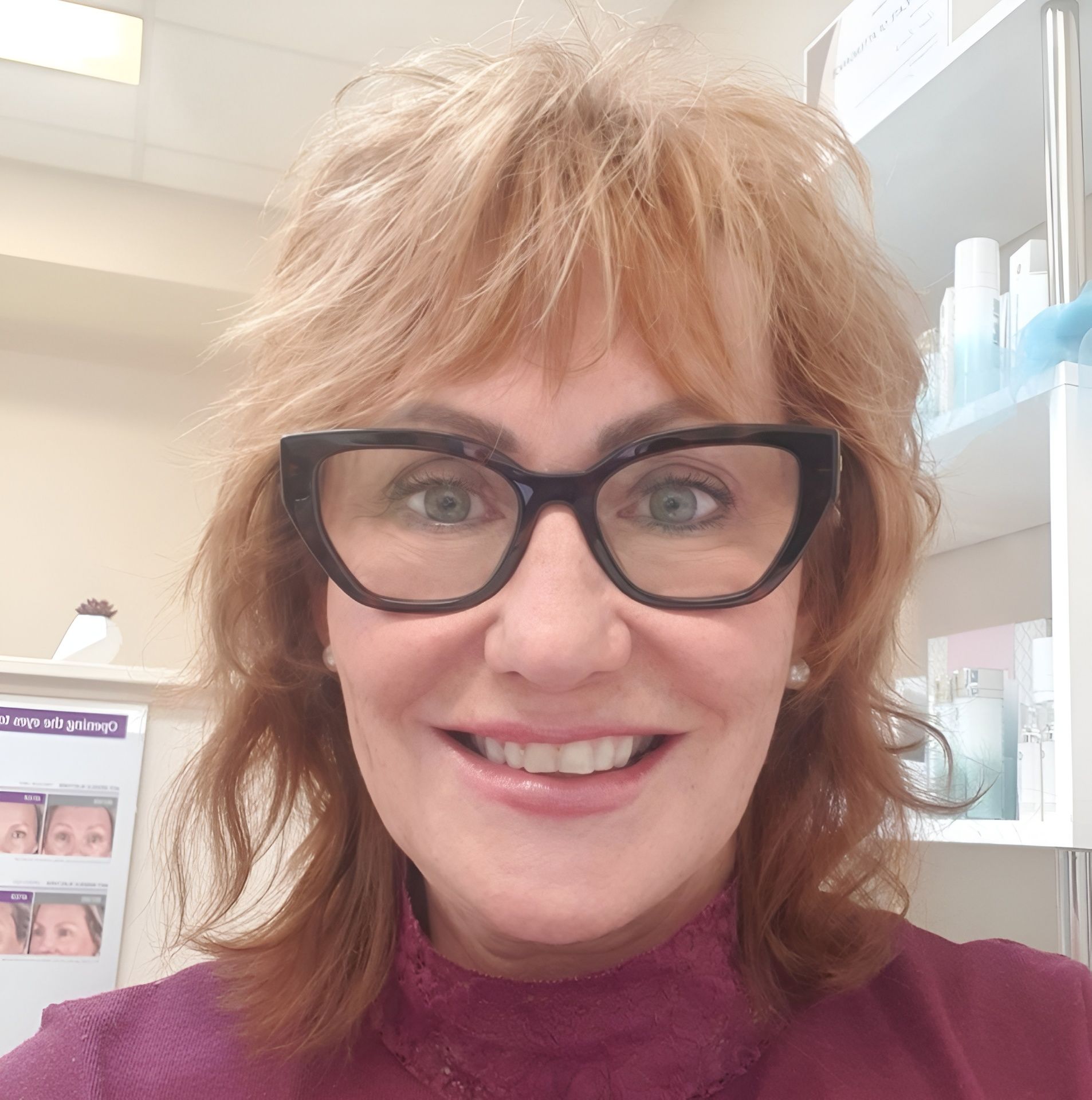 Woman With Auburn Hair and Glasses Smiles — Embrace Cosmetic Clinic in Bundaberg North, QLD