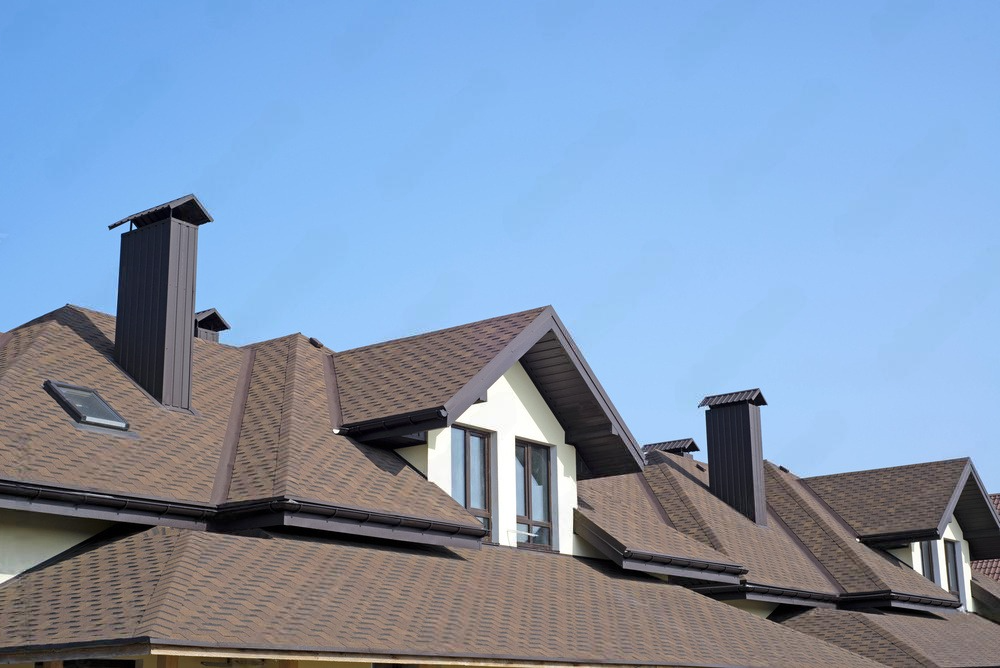 a house with brown roof and chimney