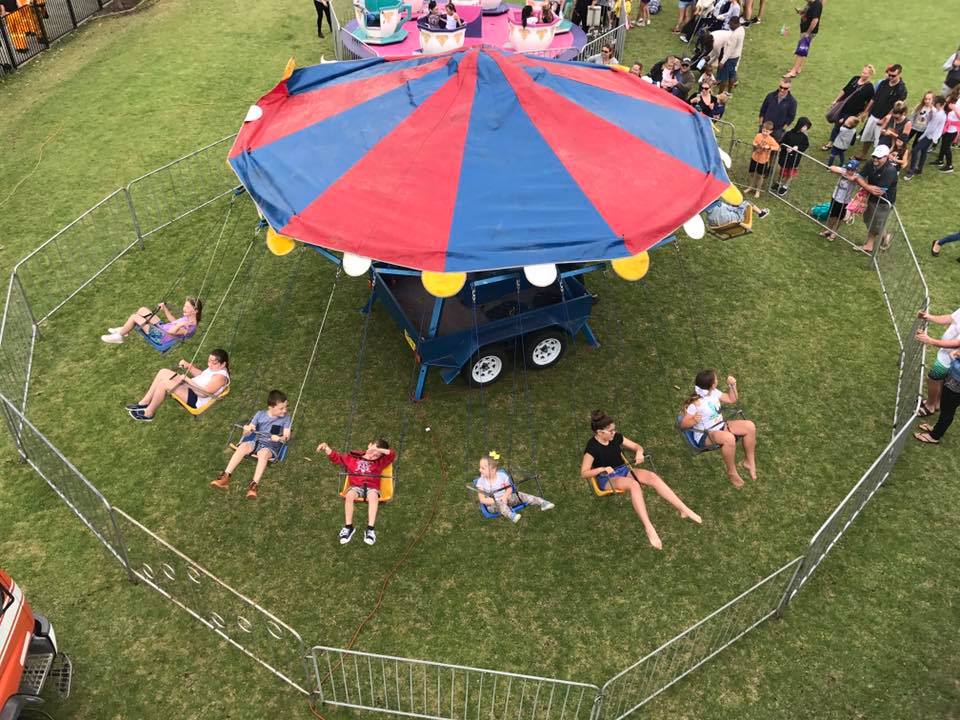 School fete event with carnival rides