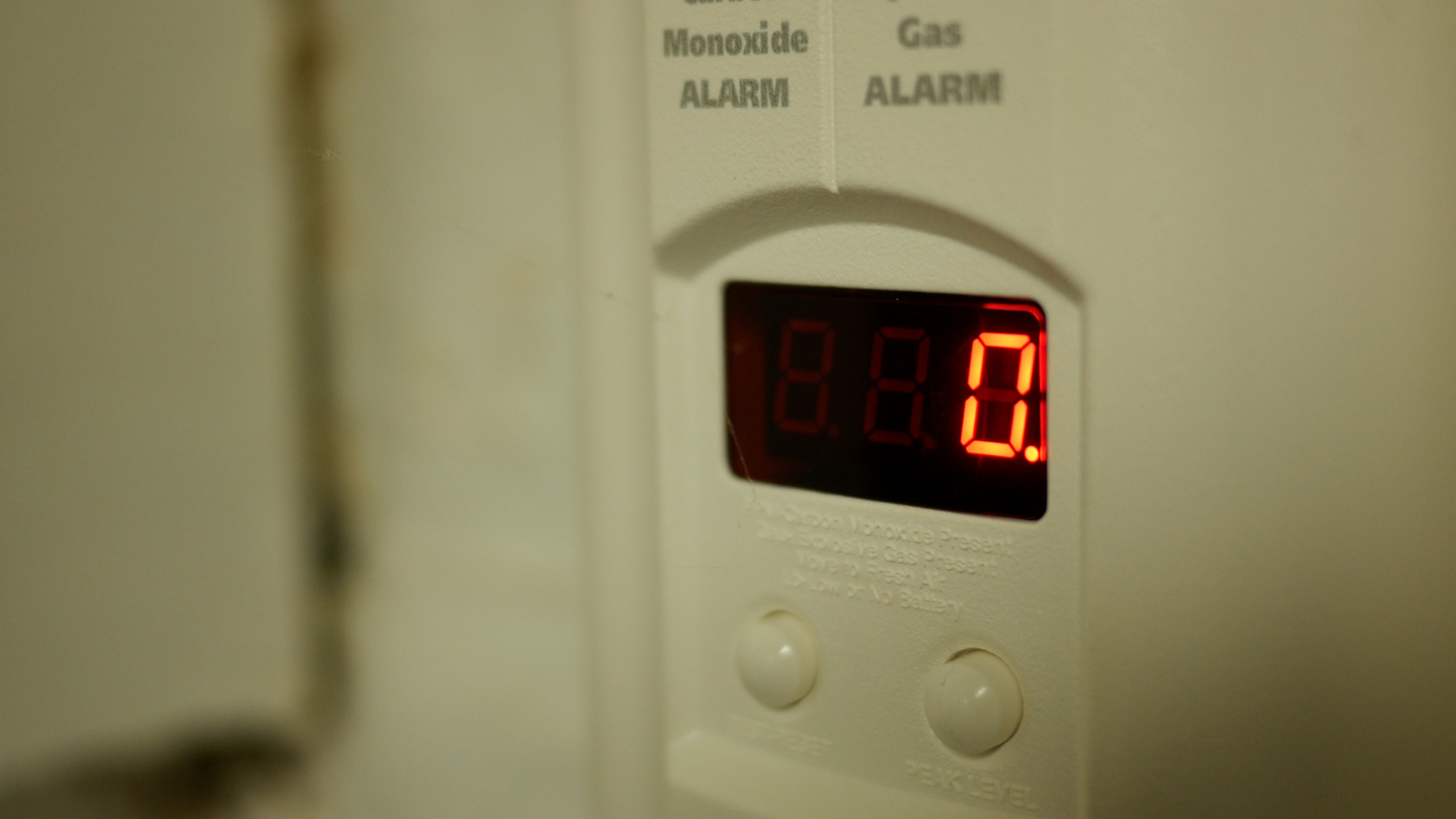 A white appliance with a digital display showing 