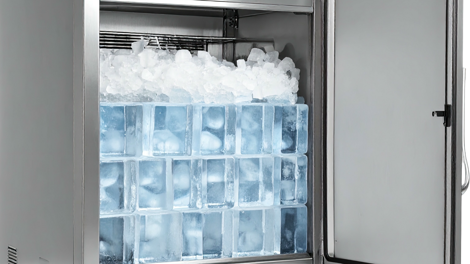 Ice machine with a partially open door, filled with large ice cubes and crushed ice.