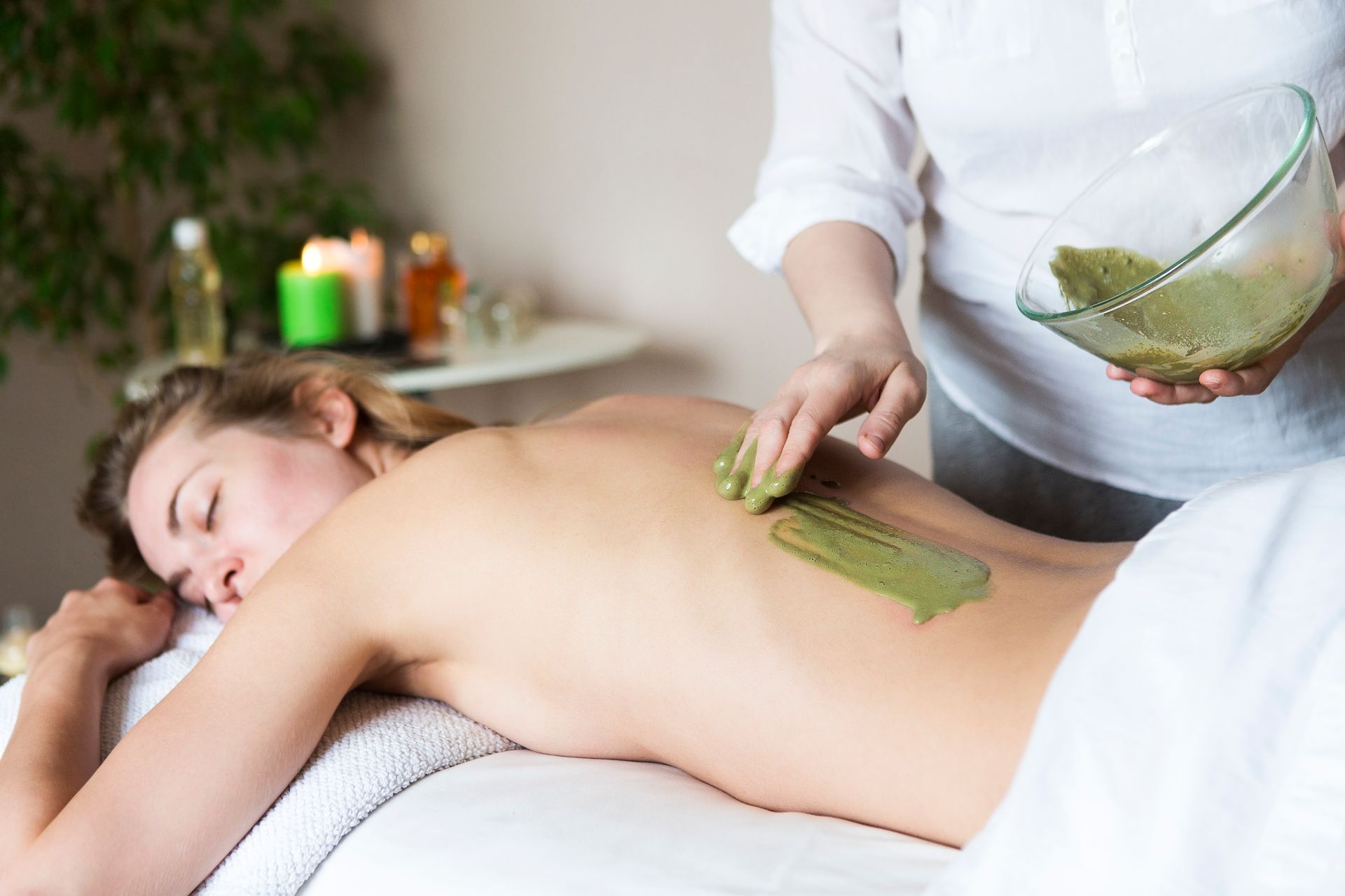 A woman is getting a massage at a spa.