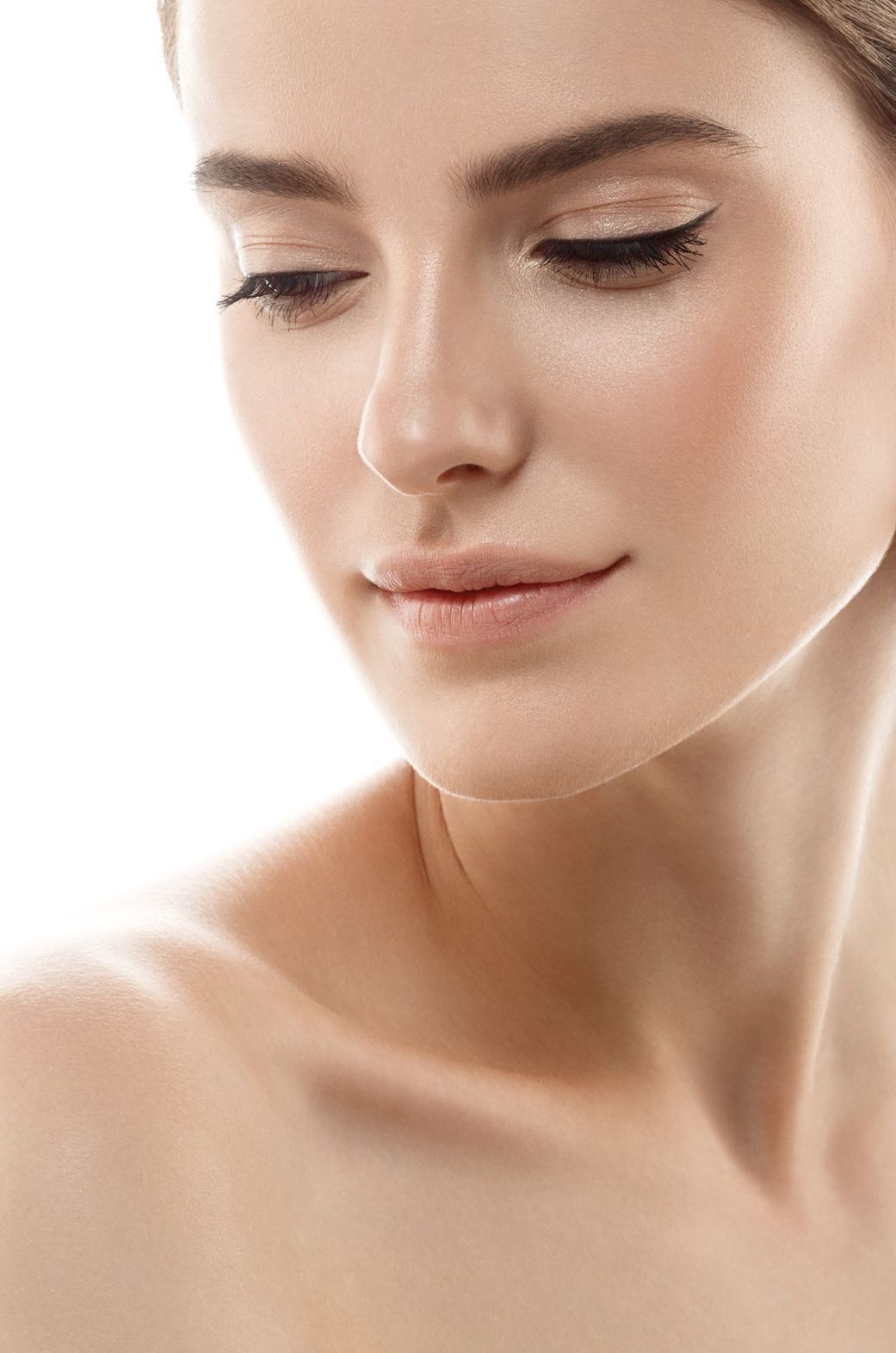 A close up of a woman 's face and neck on a white background.