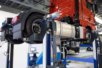 The engine of a car is shown with the hood open.