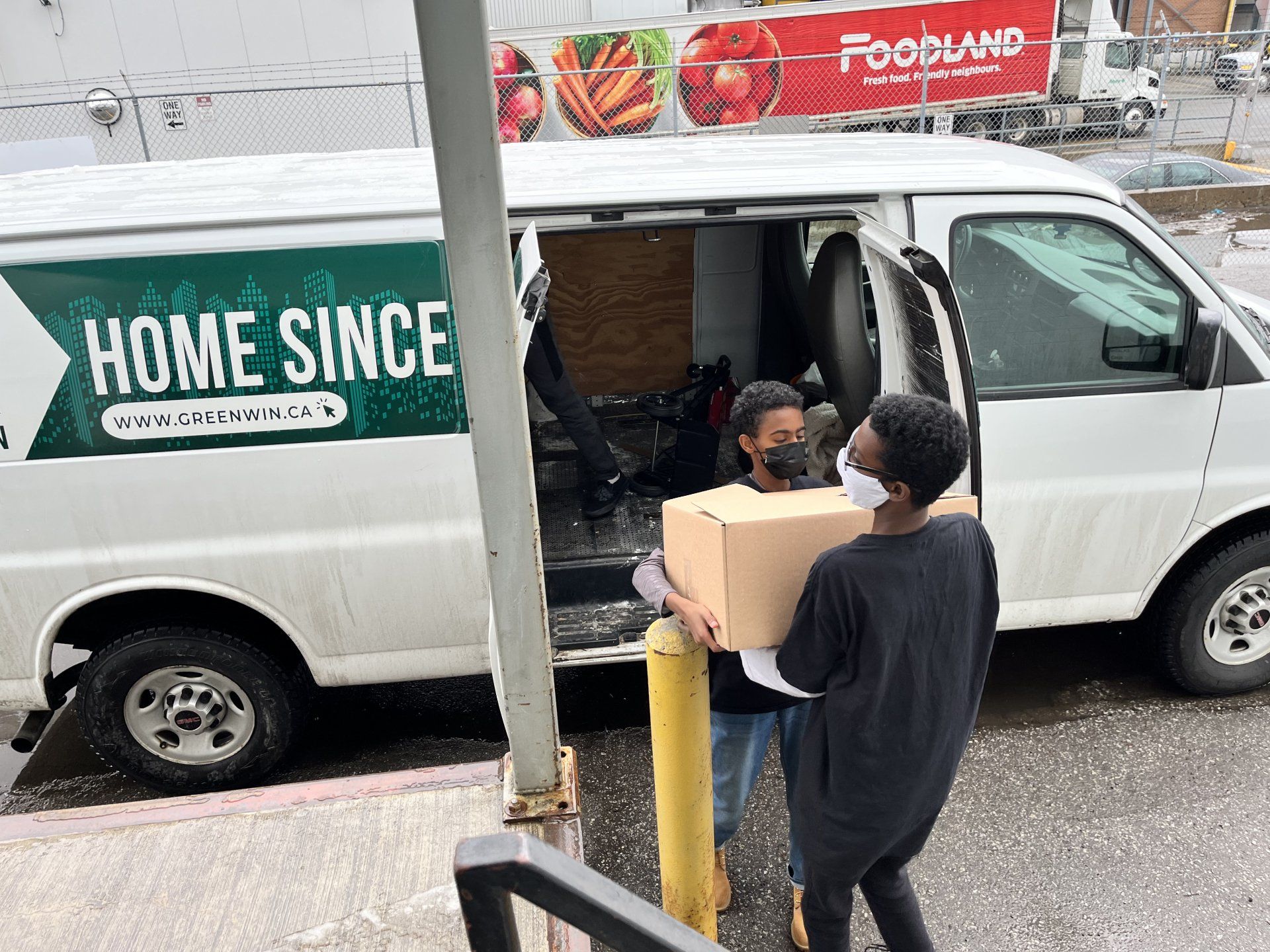 Volunteers loading food in Van