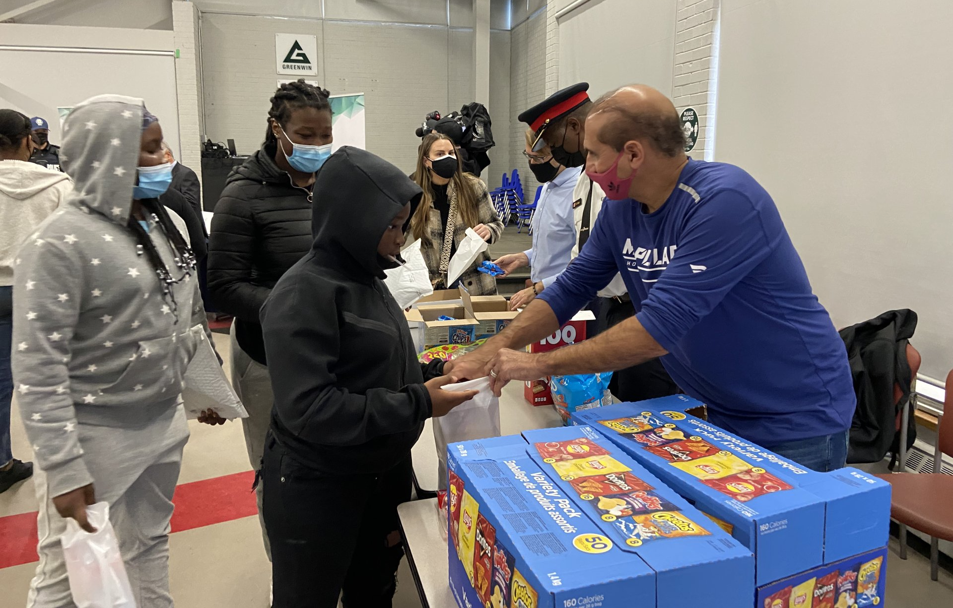 Kevin Green handing out treats to students
