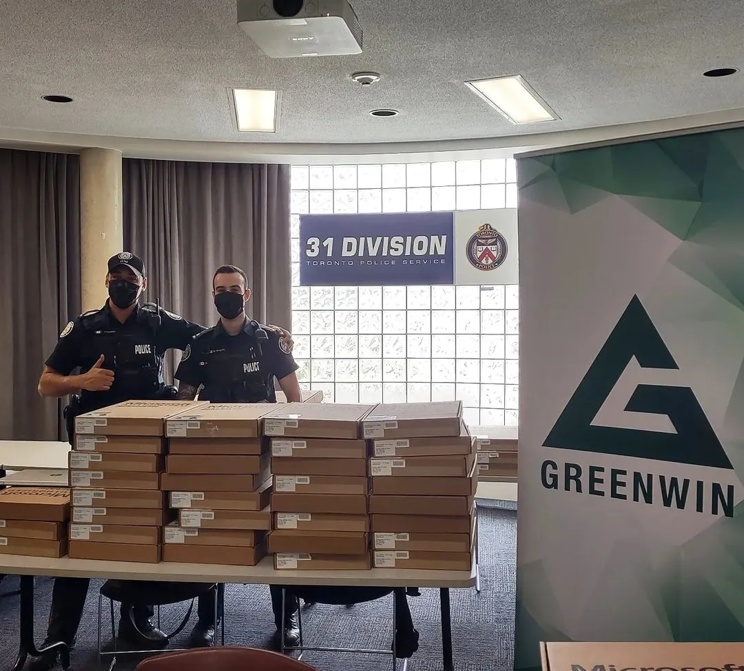 Officers standing behind boxes