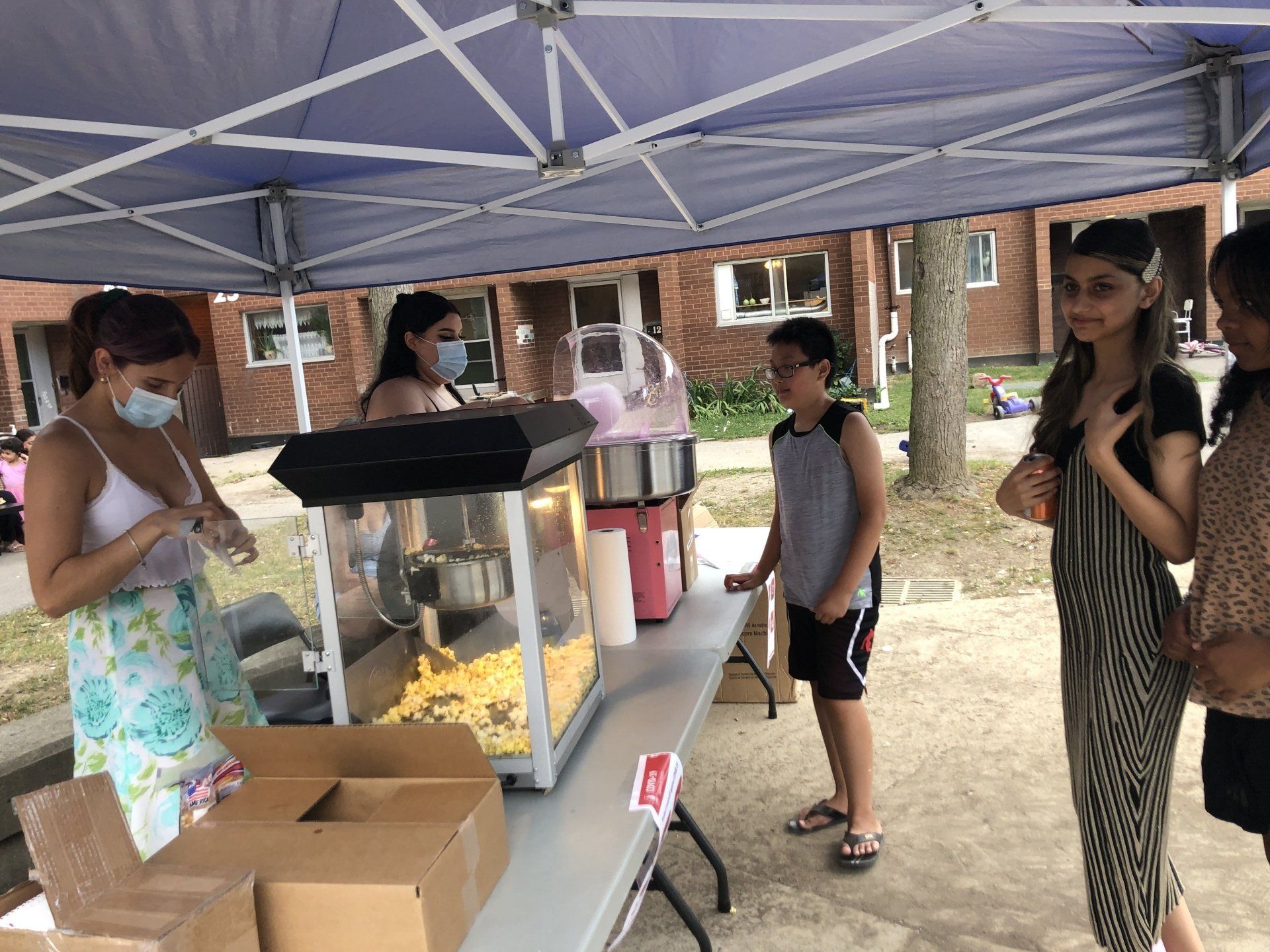 Youth making cotton candy