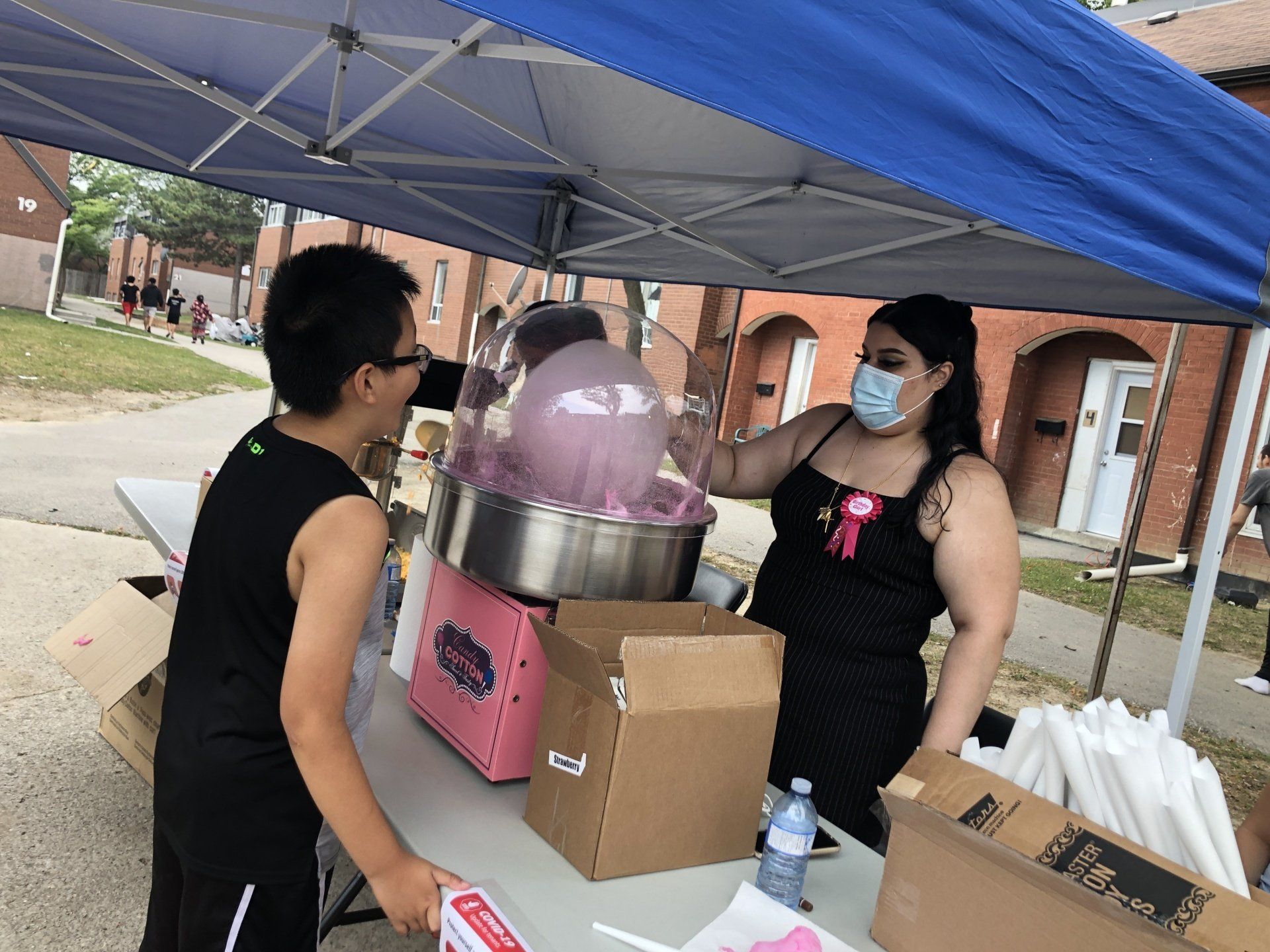 Youth making cotton candy