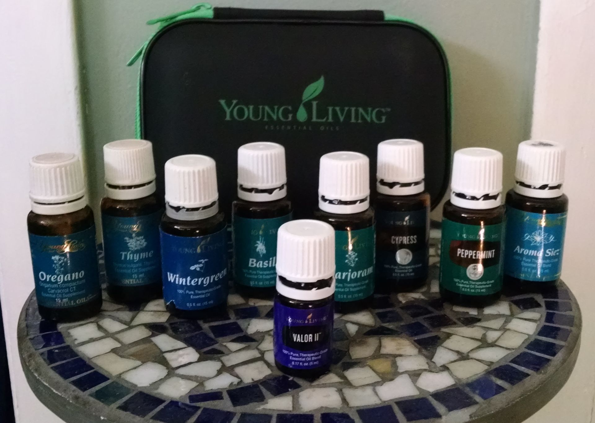 Bottles of young living essential oils on a table