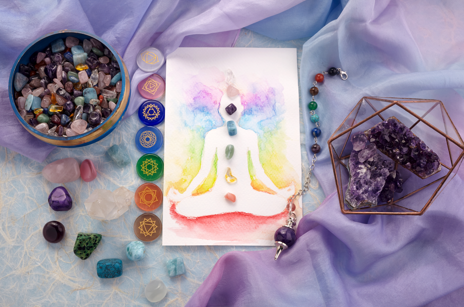 A painting of a person in a lotus position surrounded by chakras and crystals.