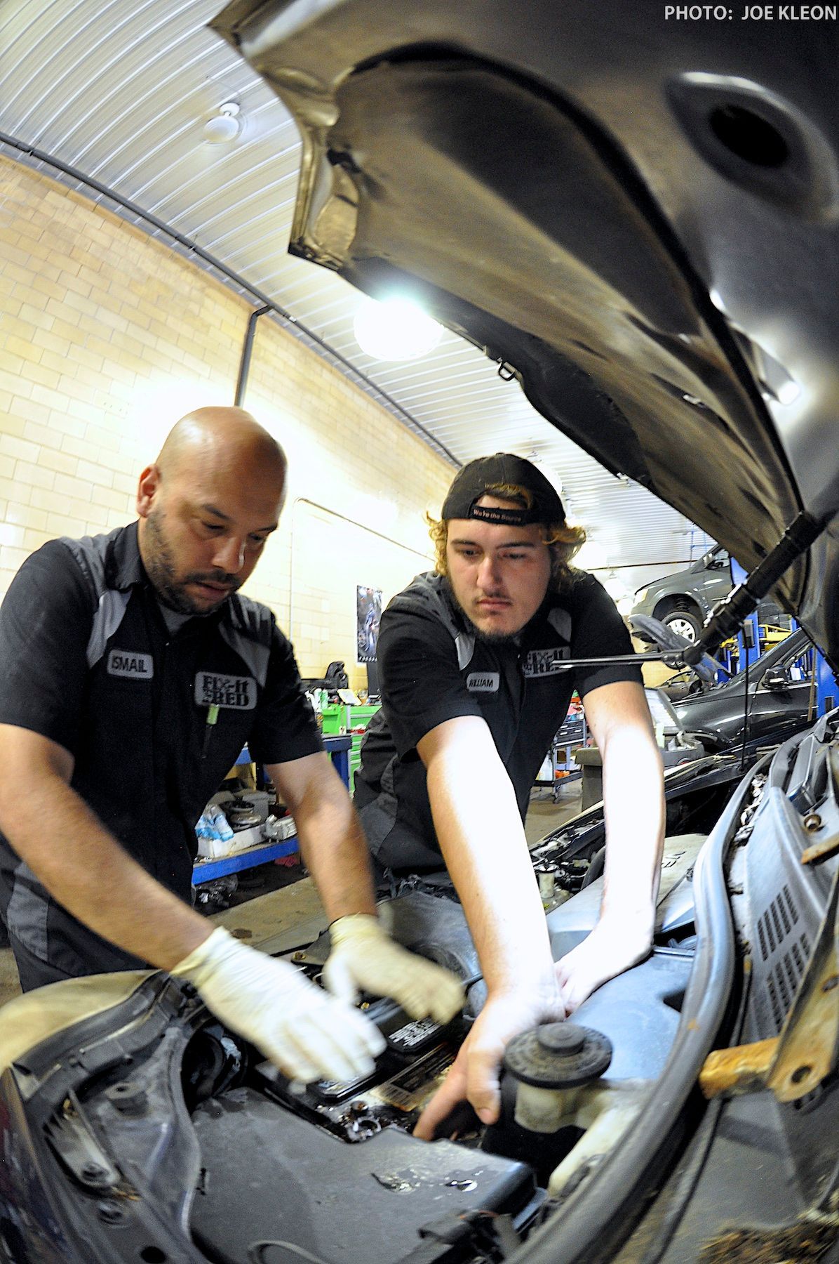 Technicians Inspecting Undercarriage of a Vehicle | Fix-it With Fred