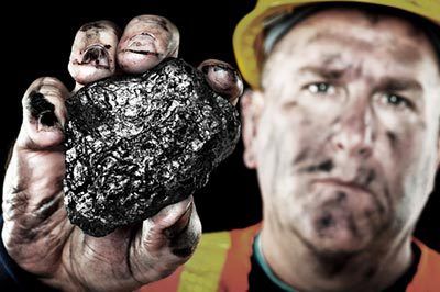 Coal miner holding a piece of coal in Princeton