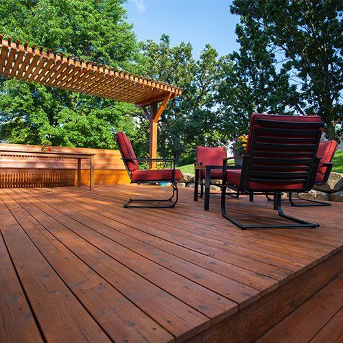 Backyard Deck with Deck Chairs and a Pergola — Braddock, PA — INC Restoration Services LLC