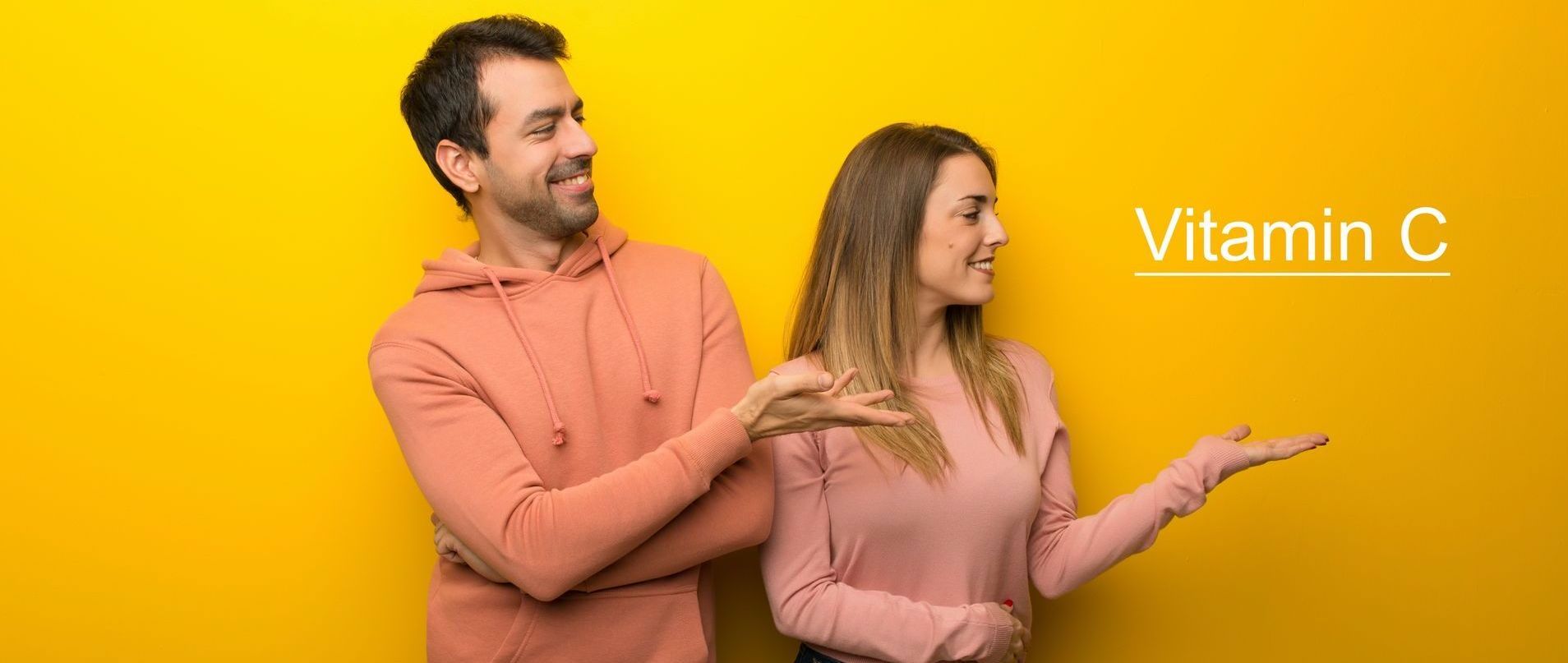 A man and a woman are standing next to each other on a yellow background.