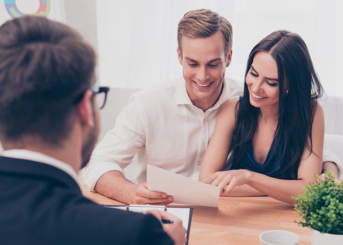 Certified Accountants — Accountant Giving Consultation To Couple In Treasure Coast, FL