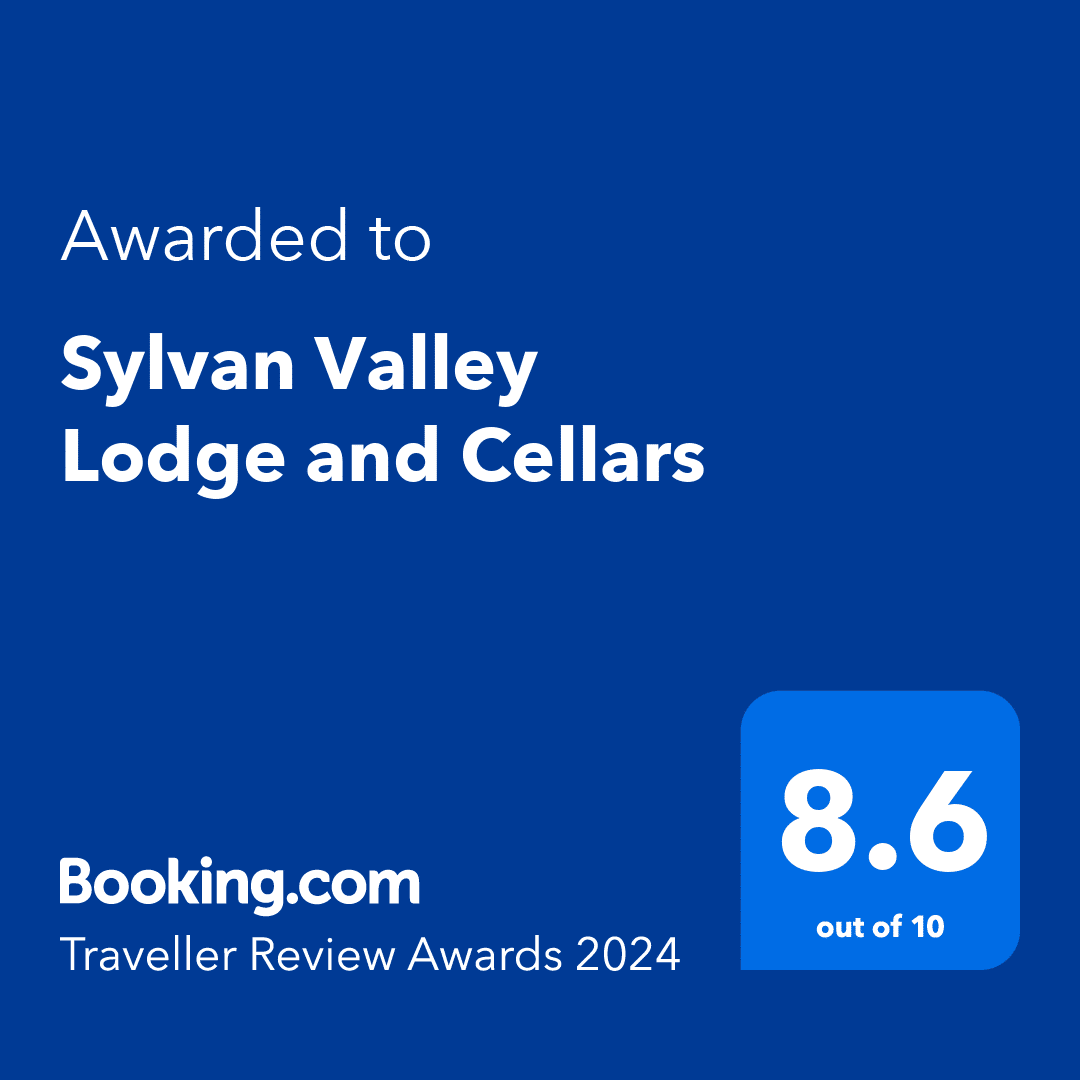 A blue sign that says `` awarded to sylvan valley lodge and cellars ''
