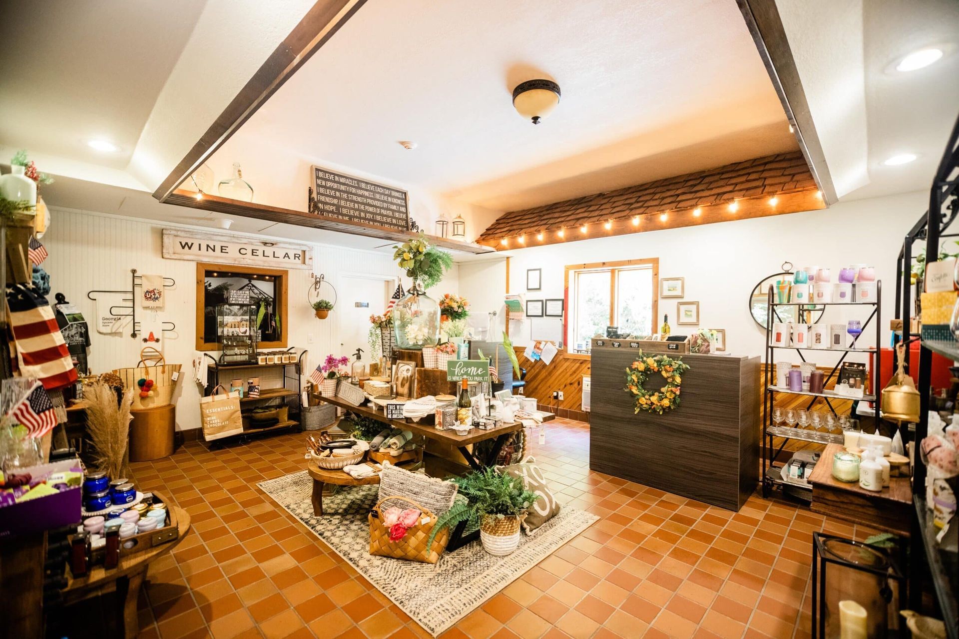 A living room filled with furniture and a counter in a store.