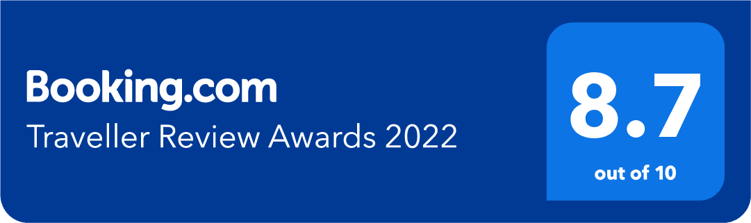 A blue sign that says booking.com traveler review awards 2022