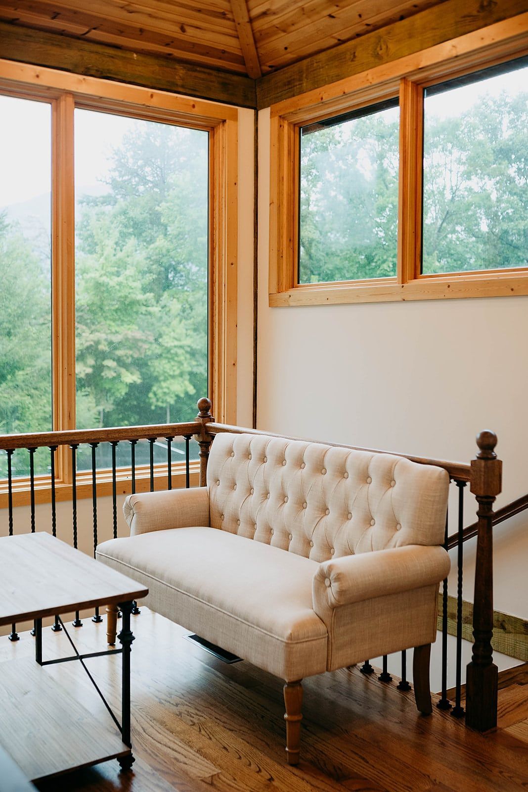 There is a couch and a table in the room.