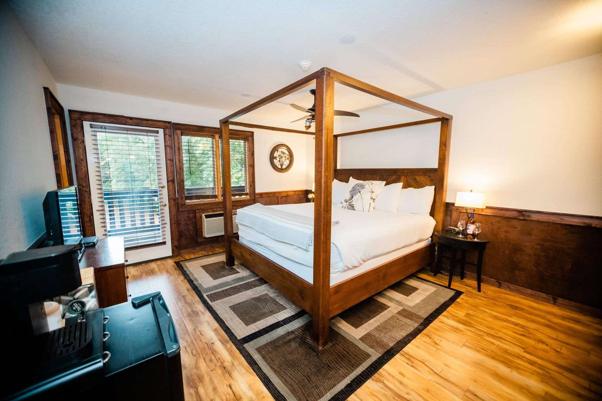 There is a four poster bed in the middle of the room.