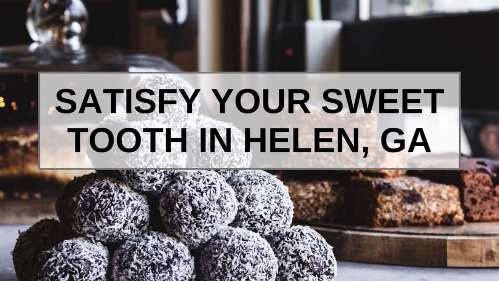 A bunch of cookies on a table with the words satisfy your sweet tooth in helen , ga