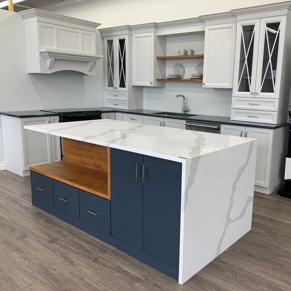 A kitchen with a large island in the middle of it.