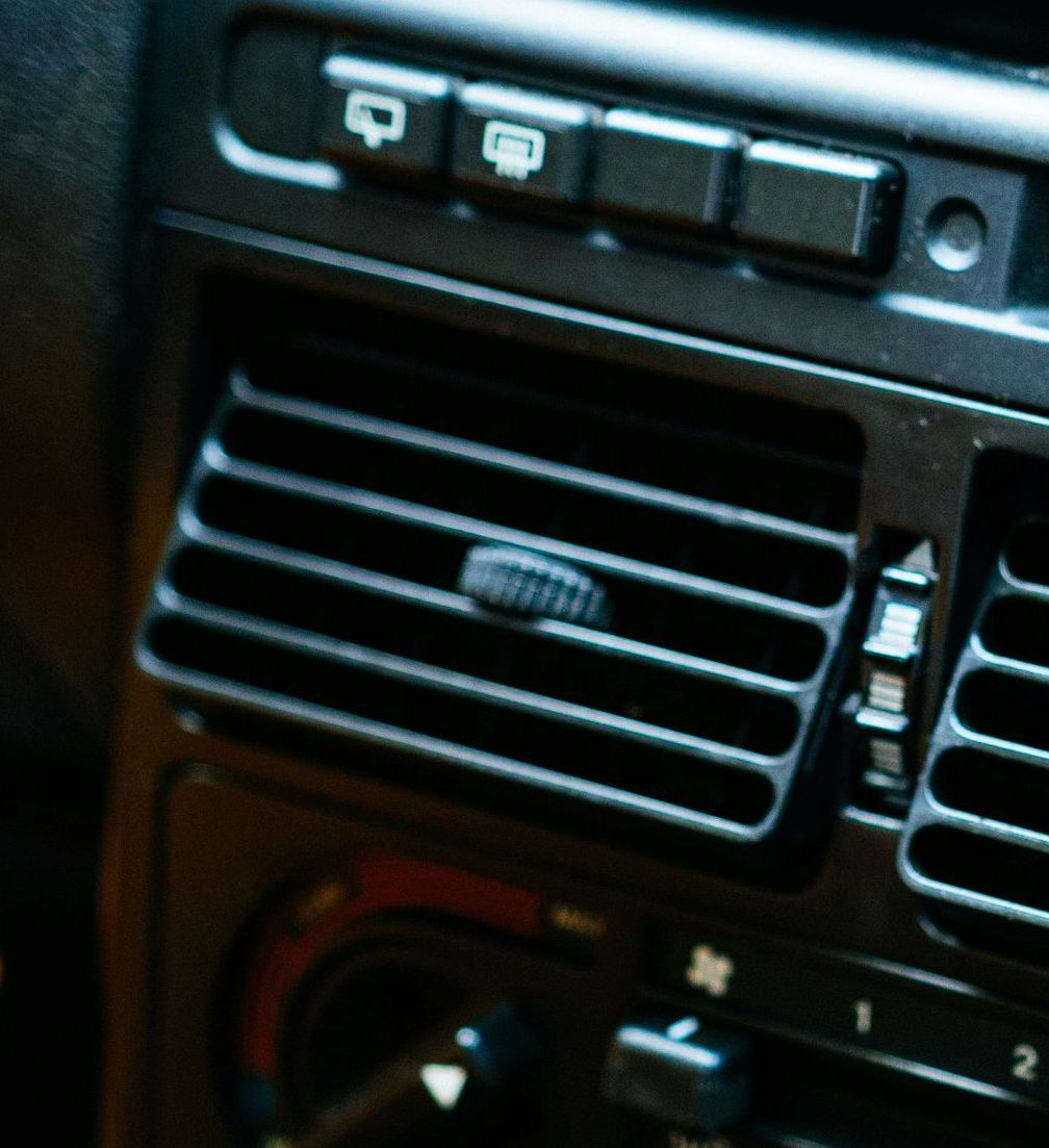 A close up of an air vent in a car