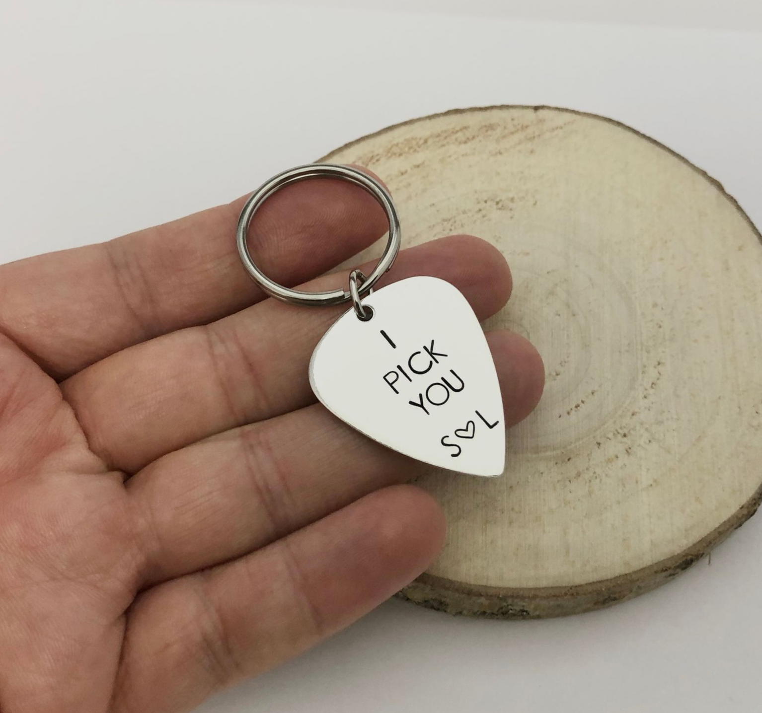 Silver guitar pick keychain engraved with 